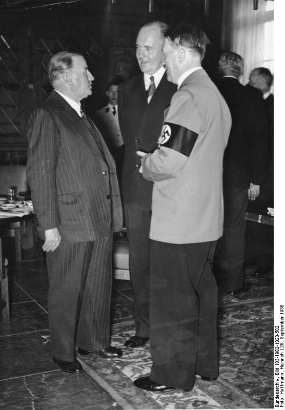 Daladier, the French Prime Minister, speaking to Hitler through interpreter Paul Schmidt, at the Munich Conference in München